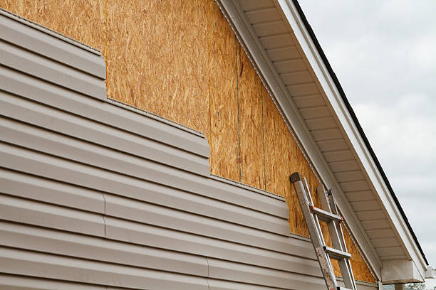 Professional Storm Damage Siding Repair technician working in Wakefield, VA